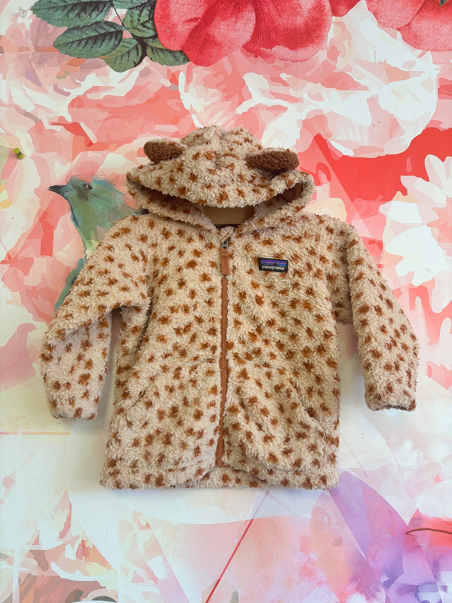 Patagonia fleece jacket with animal print and ears on hood. Size 6-12m