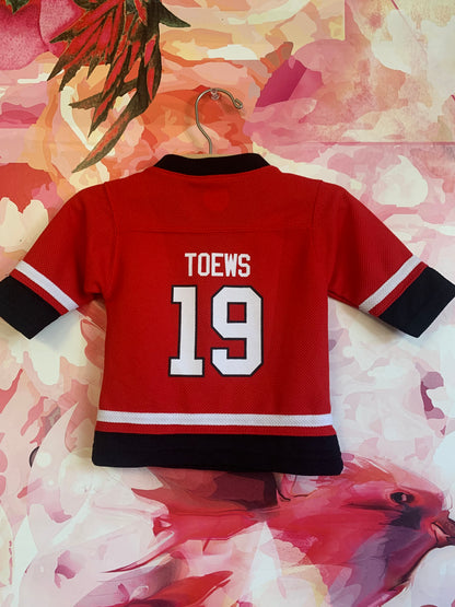 NHL red/black Blackhawks jersey. Toews #19. Size 12m