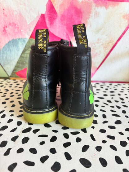 Doc Martens black leather boots with glow in the dark neon green skeleton foot bones. Size 10.