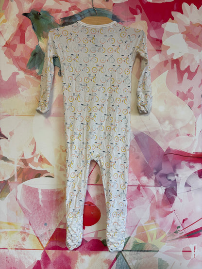 Magnetic Me cream romper with bicycles. Magnet closure. Size 12-18