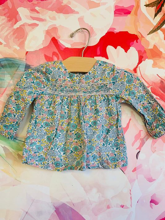 Baby Boden blue pink & teal flower long sleeve top with lining. Smocking on front & buttons on back. Size 3-6m