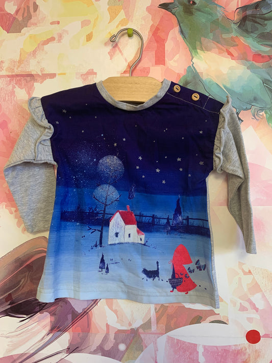 deux par deux long sleeve top with night scene, child in red cape & white house. Size 12m