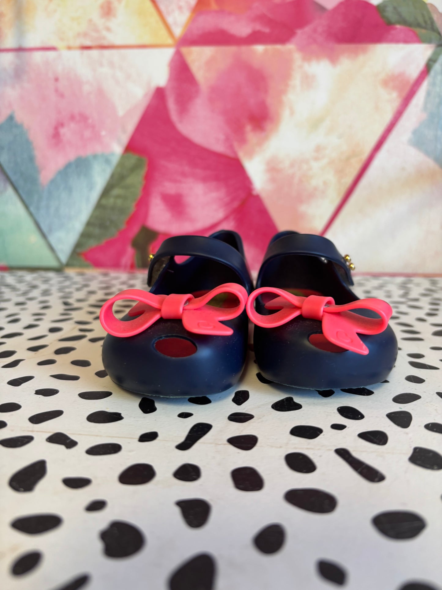 Mini Melissa blue shoes with Velcro strap & bright pink bow. Size 6.