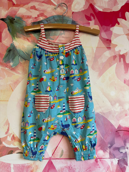 Baby Boden blue romper with red/white stripes and beach scenes. NEW WITH TAGS. size 3-6m