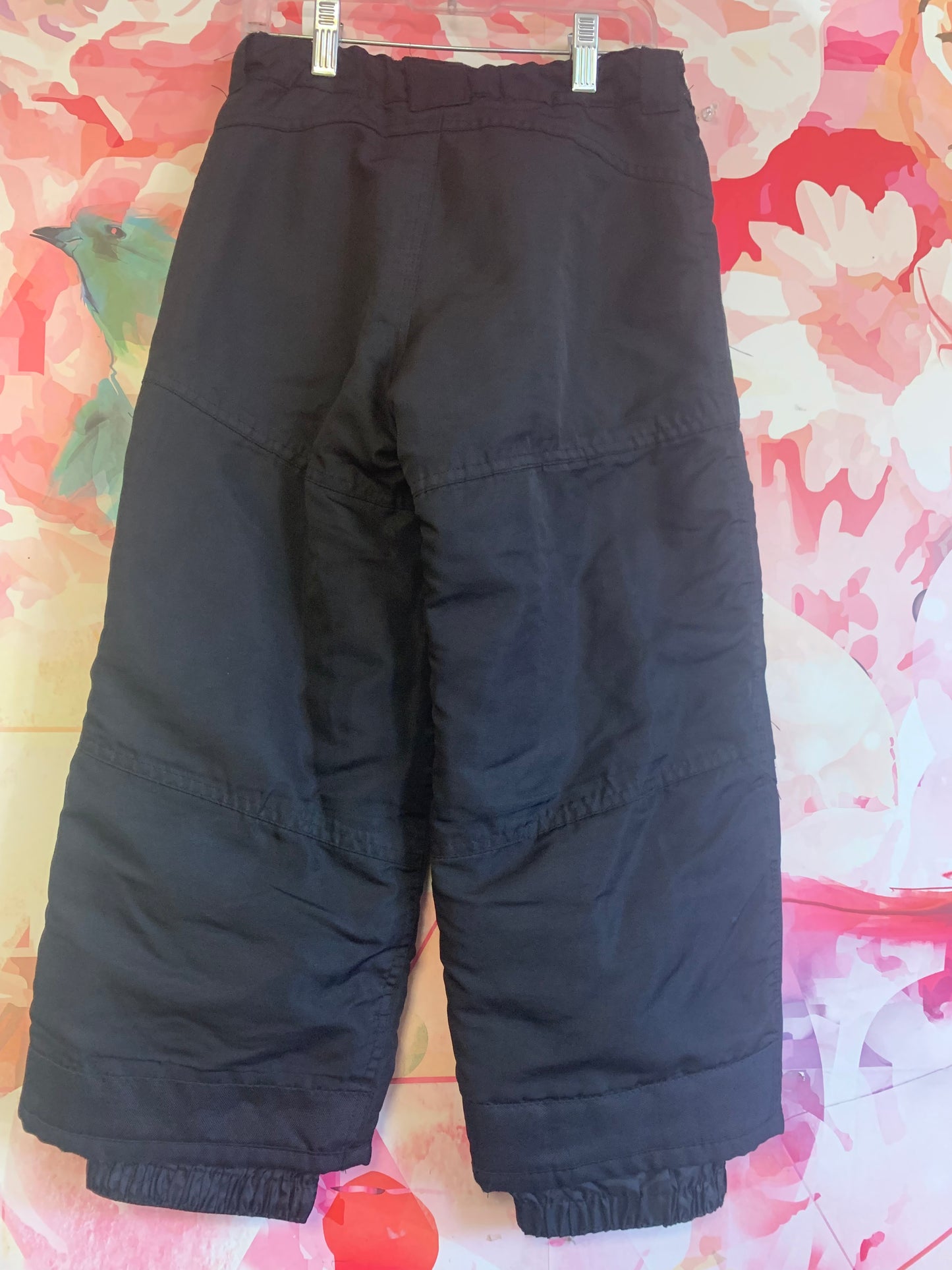 Cherokee black snow pants. Adjustable Velcro waist. Light wear on right knee (see second photo) size 4/5