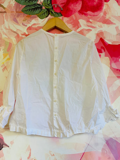 Il Gufo white blouse with buttons down back. Bow on wrist. Size 10