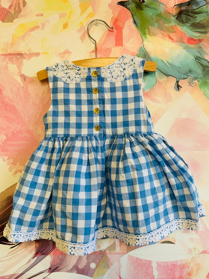 OshKosh blue & white checkered dress with lace collar and pockets. Full lined skirt. Size 12m