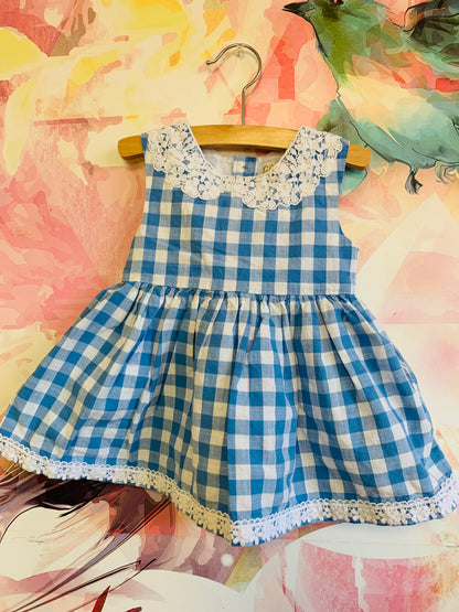 OshKosh blue & white checkered dress with lace collar and pockets. Full lined skirt. Size 12m