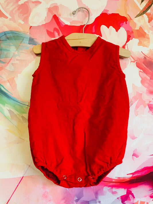 Os Estorninhos red corduroy sleeveless romper with buttons on back. Size 12-18m