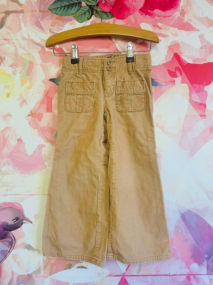 Baby Gap beige bell bottom corduroy pants. Two buttons and zipper with front pockets and belt loops. Size 4T