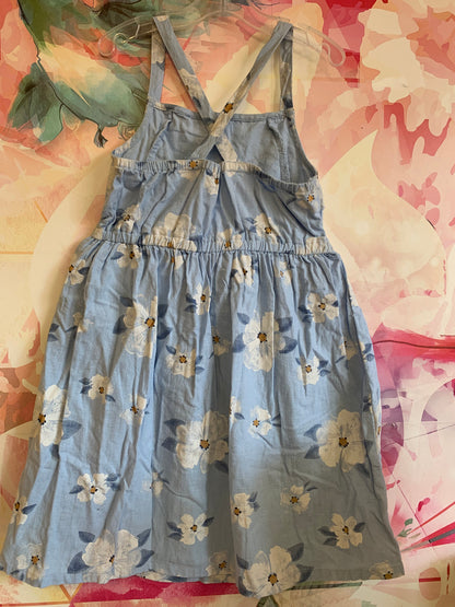 Carter’s blue dress with white flowers. Criss cross straps. Size 7T