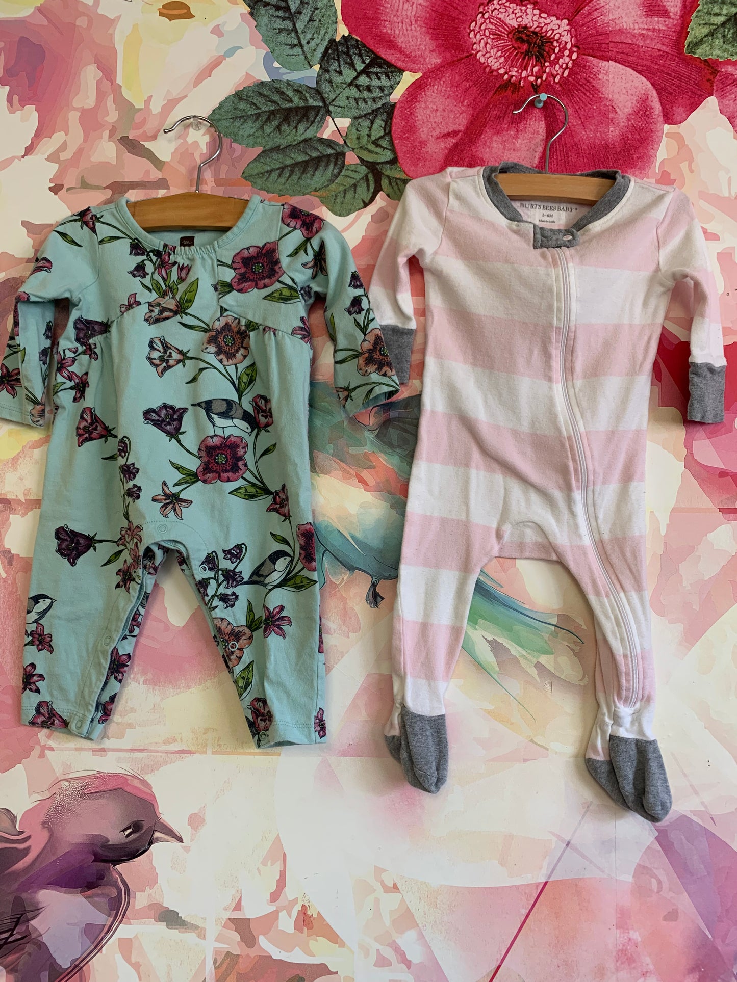 2 long sleeve rompers. Both 3-6m. Burt’s Bees pink/white stripe footed romper. Tea Collection teal flowery long sleeve romper with snaps.