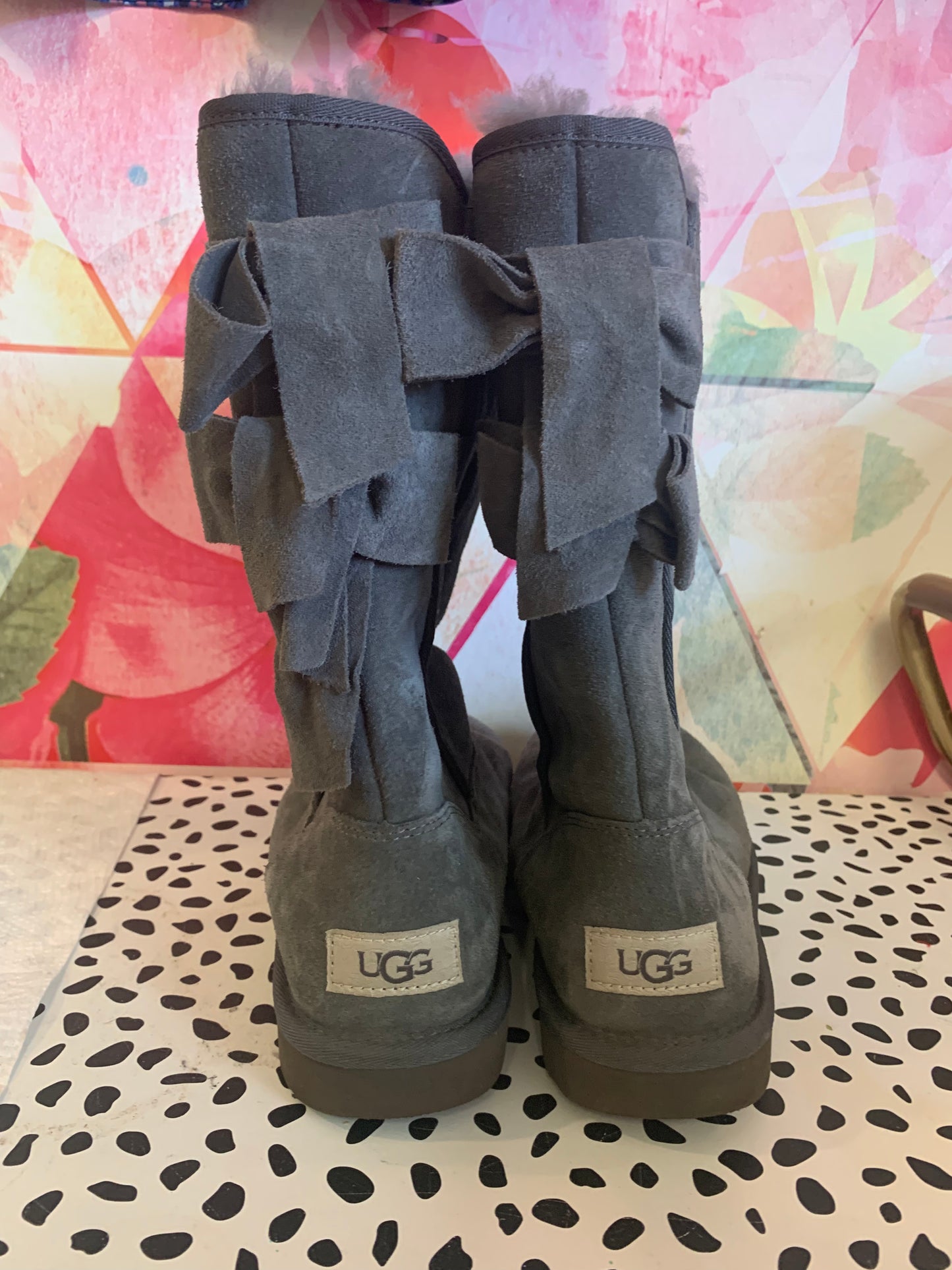 Ugg grey tall winter boots with two bows on back. Size 6.