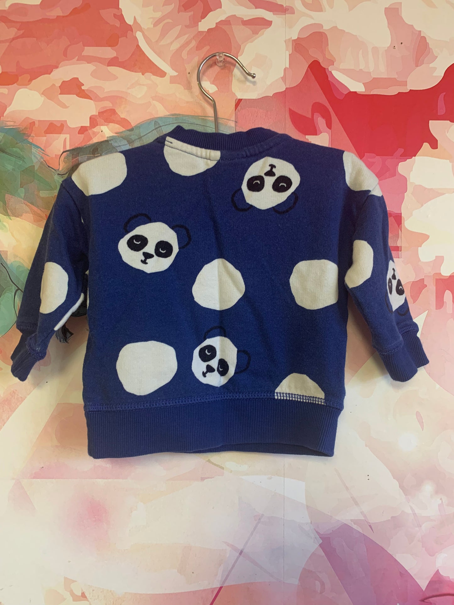 Hanna Andersson blue sweatshirt with black & white panda faces. Shoulder snaps. Size 3-6m