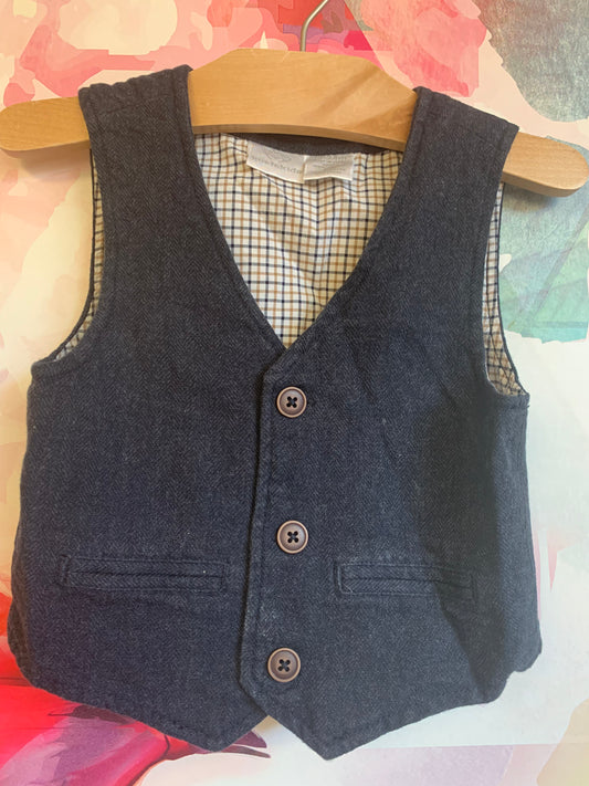 Koala Kids dark grey herringbone vest with plaid lining.