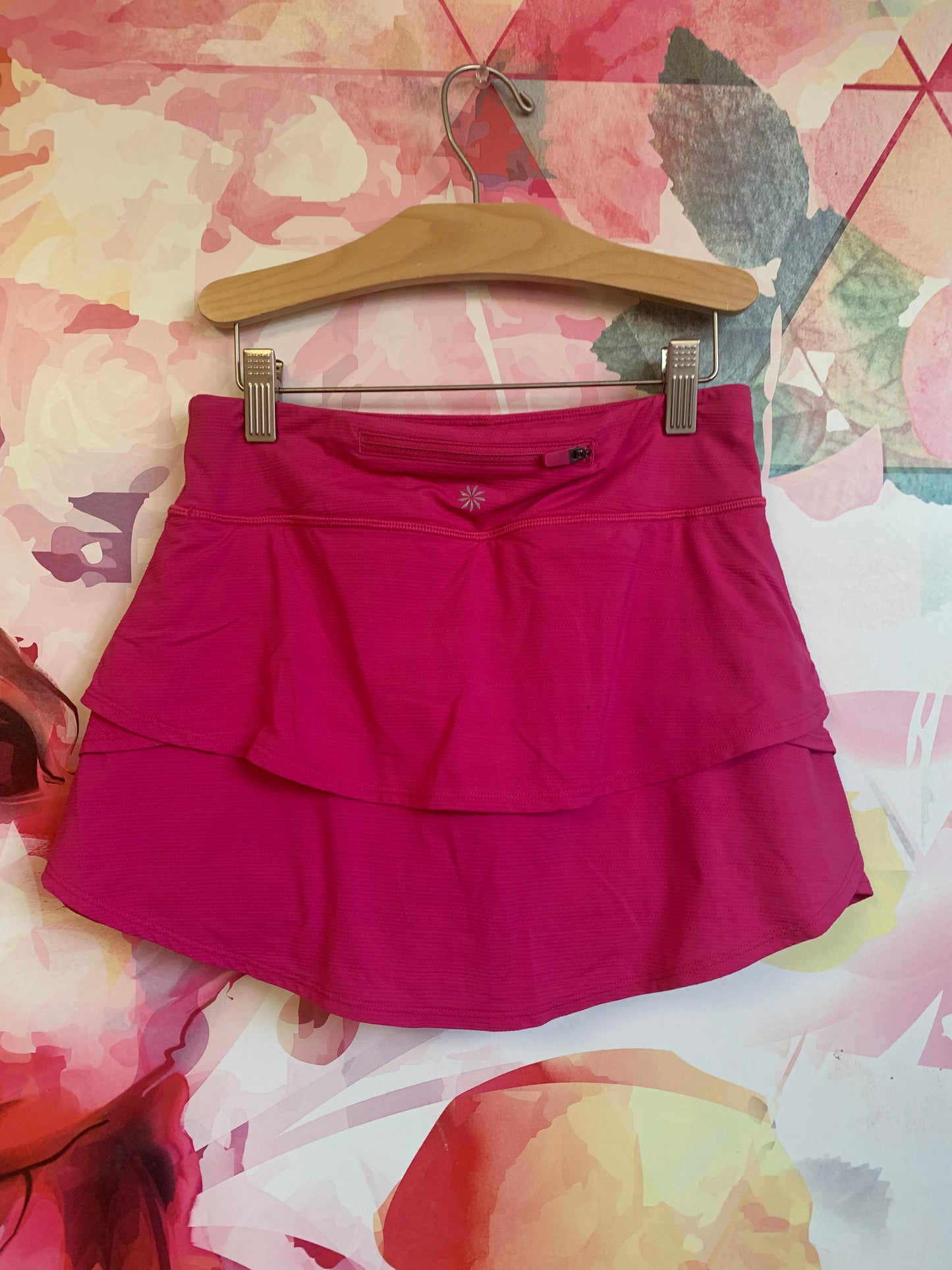 Athleta Girl fuschia skort. Zipper pocket on back. Extra pockets on shorts underneath. Size 12.